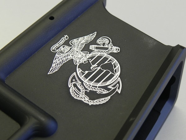 Custom engraved military emblem on lower receiver of AR-15 rifle