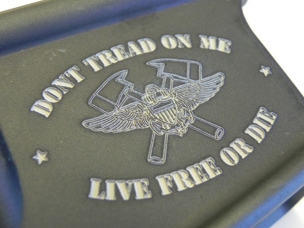 Custom engraved logo on lower receiver of AR-15 rifle